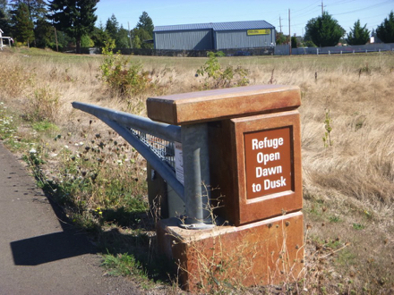 Sign posted on entrance gate - &ldquo;Refuge Open Dawn to Dusk&rdquo;