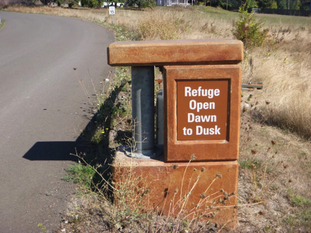 Sign posted on entrance gate - &ldquo;Refuge Open Dawn to Dusk&rdquo;