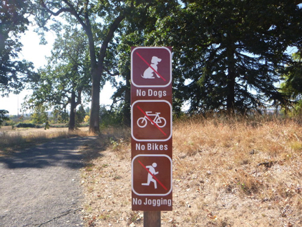 Sign of refuge rules at the start of trail to bus stop &ldquo;no dogs, no bikes, no jogging&rdquo;